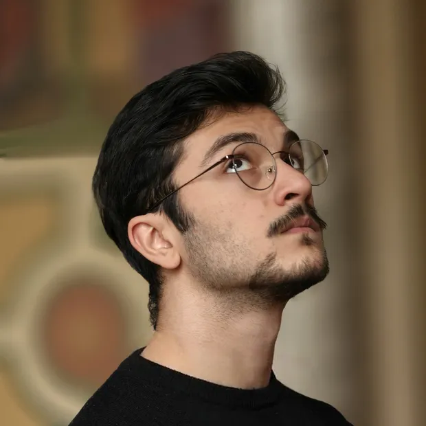 Ismail Adiyaman, looking up at something out of frame